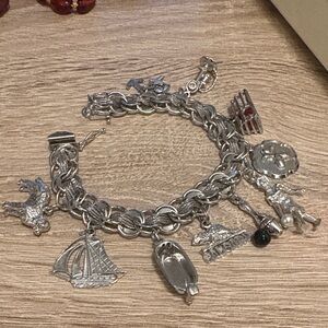 Vintage 925 sterling charm bracelet with 10 sterling charms